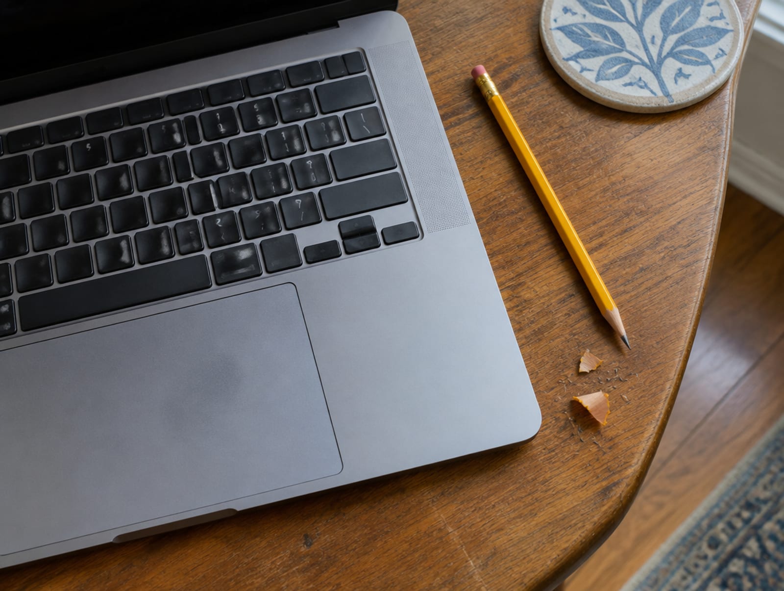 Laptop on a kitchen table showing a county contractor registration list
