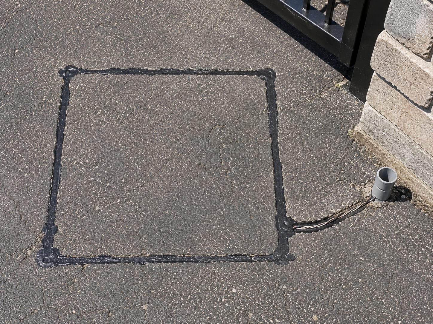 premium smart entry gate safety loop detector sensor installed drivewa by Portillo Fences and Gates